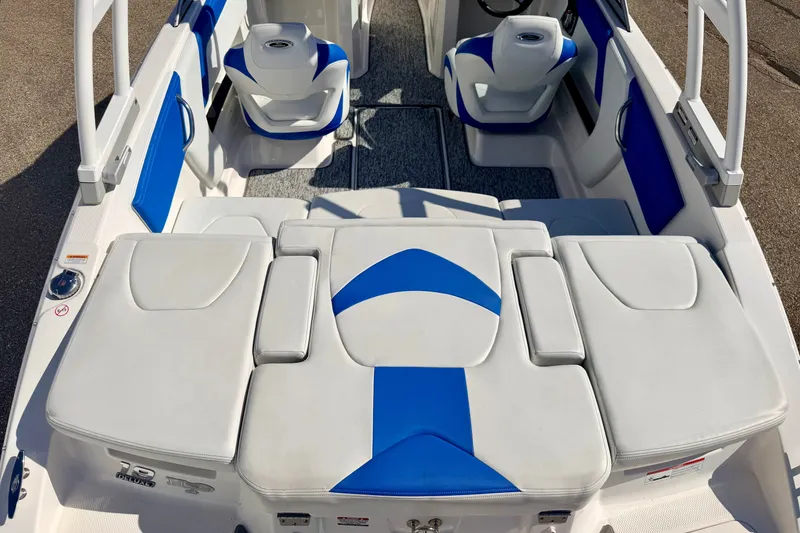 Slide: The Image of 2017 Chaparral 19 Sport H2O boat interior with blue and white seating. - 26