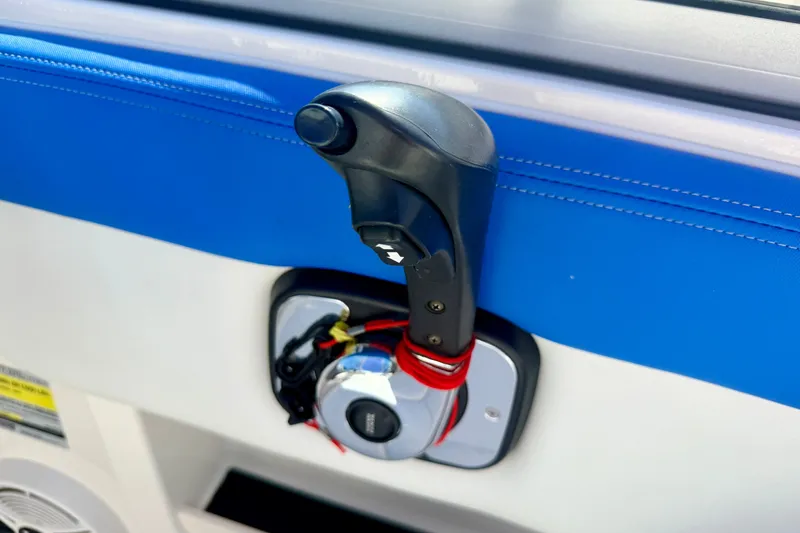 Slide: The Image of Throttle control lever on 2017 Chaparral 19 Sport H2O boat, blue and white interior. - 47