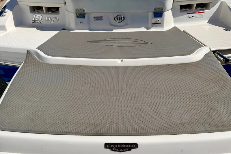 Slide: The Image of 2017 Chaparral 19 Sport H2O boat with extended swim platform, rear view. - 25