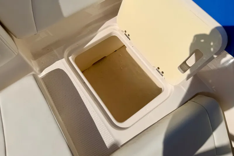 Slide: The Image of Open storage compartment on 2017 Chaparral 19 Sport H2O boat interior. - 41
