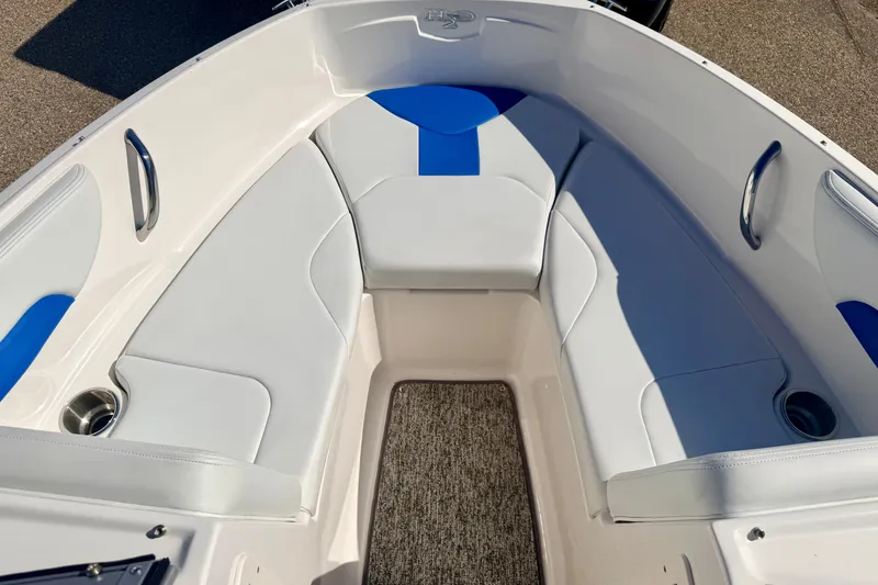 Slide: The Image of 2017 Chaparral 19 Sport H2O boat interior with white and blue seating. - 60