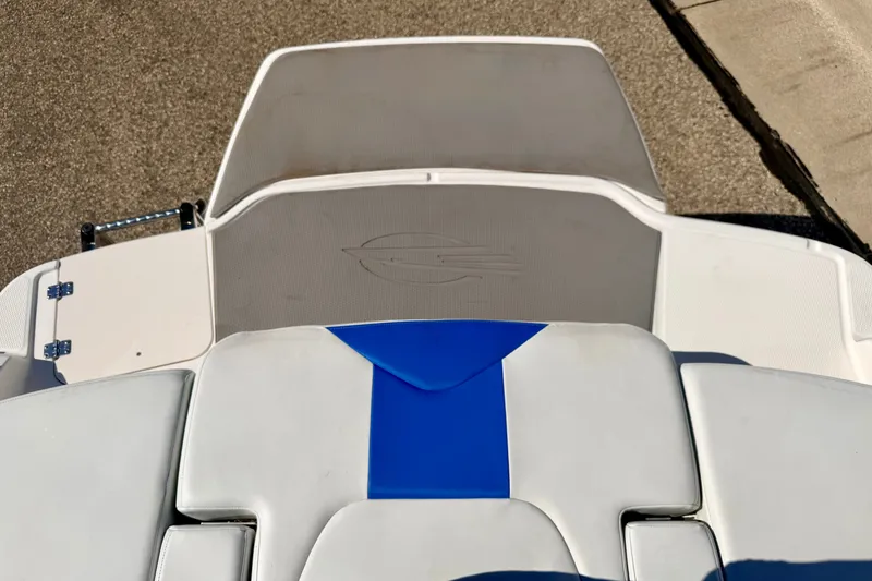 Slide: The Image of 2017 Chaparral 19 Sport H2O boat interior with blue and white seating. - 27