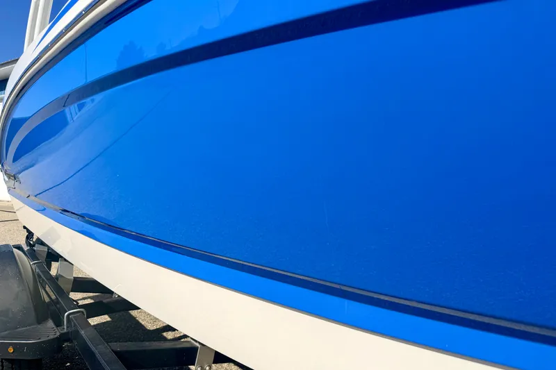 Slide: The Image of Blue Chaparral 19 Sport H2O boat hull, 2017 model, on a trailer. - 15