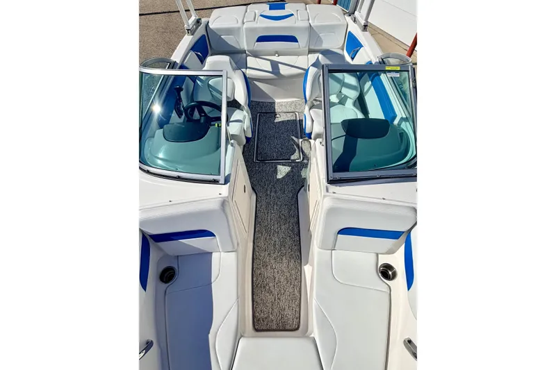 Slide: The Image of 2017 Chaparral 19 Sport H2O boat interior with white and blue seating, open cockpit view. - 72