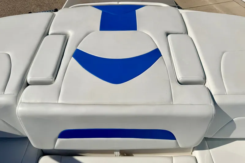 Slide: The Image of 2017 Chaparral 19 Sport H2O boat seat with blue and white upholstery design. - 34