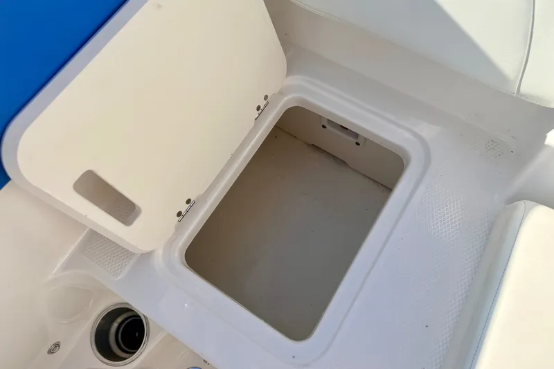 Slide: The Image of Open storage compartment on a 2017 Chaparral 19 Sport H2O boat. - 38
