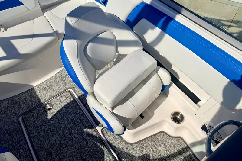 Slide: The Image of 2017 Chaparral 19 Sport H2O boat interior with blue and white seating. - 54