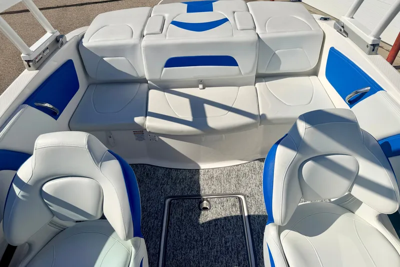 Slide: The Image of 2017 Chaparral 19 Sport H2O boat interior with white and blue seating. - 71