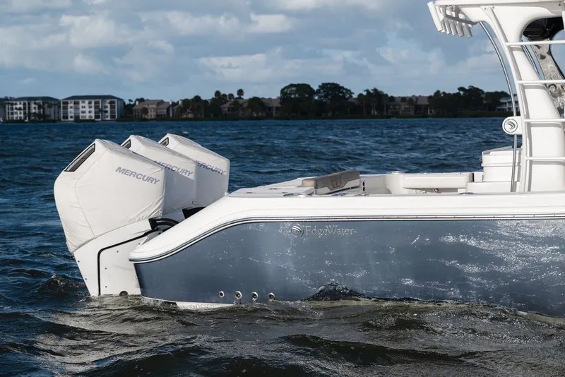 Slide: The Image of Edgewater 370CC 2020 boat with Mercury engines on a calm lake. - 10