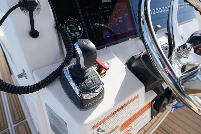 Slide: The Image of 2020 Edgewater 370CC boat helm with joystick control and steering wheel. - 30