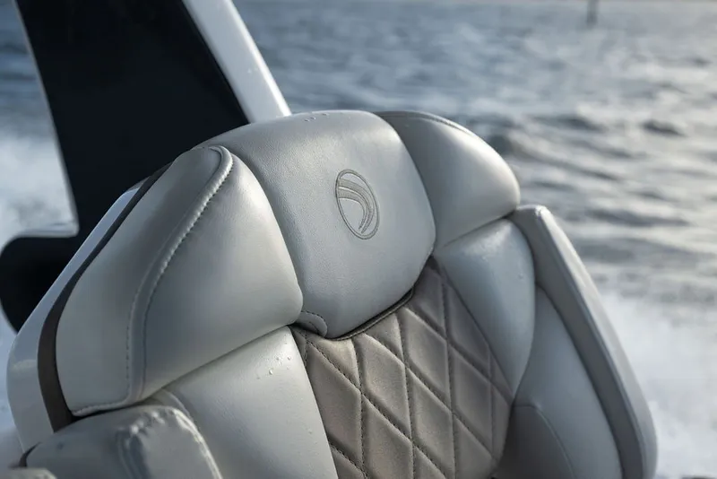 Slide: The Image of Luxurious leather seat on 2020 Edgewater 370CC boat, with ocean in background. - 15