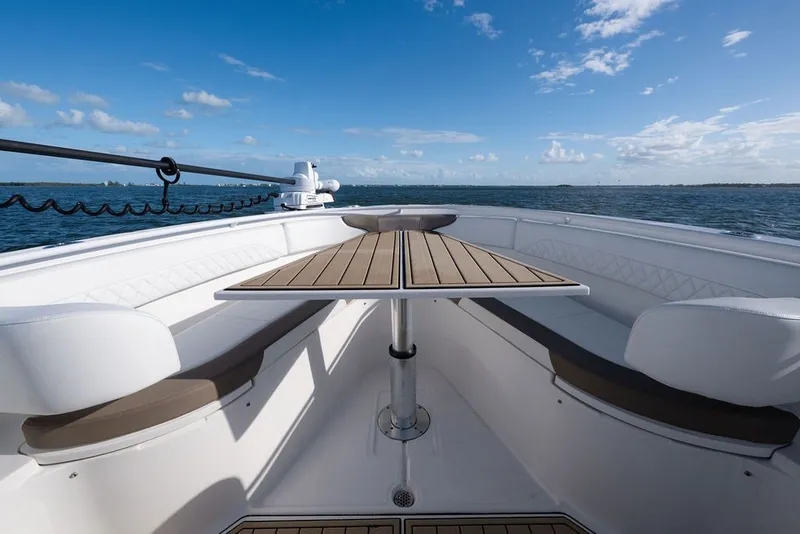 Slide: The Image of Edgewater 370CC 2020 boat interior with seating and table, ocean view. - 59