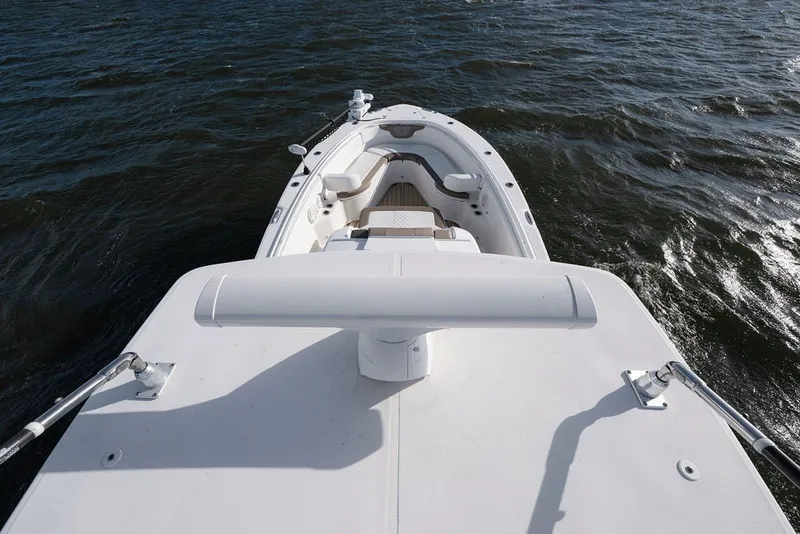 Slide: The Image of Edgewater 370CC 2020 boat on water, view from deck, showcasing seating and railing. - 26