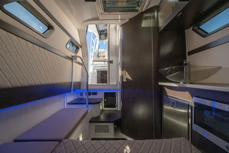Slide: The Image of Luxurious interior of 2020 Edgewater 370CC boat with modern amenities and sleek design. - 34