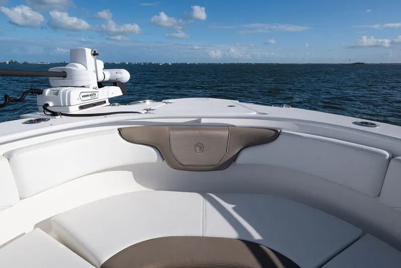 Slide: The Image of 2020 Edgewater 370CC boat interior with seating, ocean view, and Minn Kota equipment. - 40