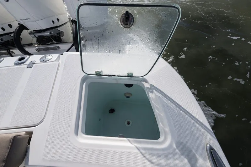 Slide: The Image of Open storage compartment on 2020 Edgewater 370CC boat, with water droplets on lid. - 53