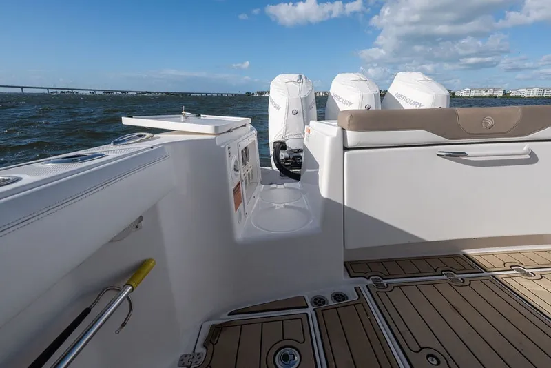 Slide: The Image of 2020 Edgewater 370CC boat interior with Mercury engines, featuring sleek seating and ocean view. - 41