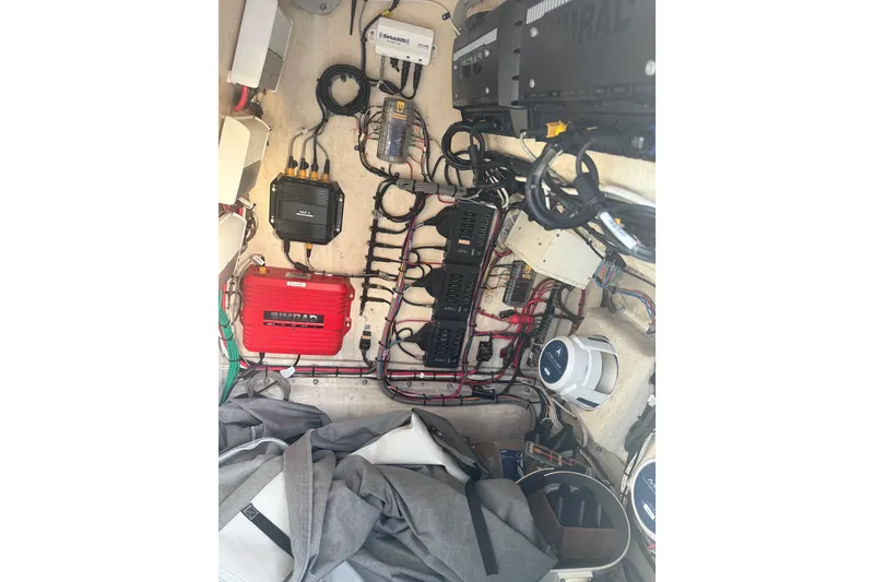Slide: The Image of Electrical system inside a 2014 Yellowfin 32 Offshore boat, showcasing wiring and components. - 18