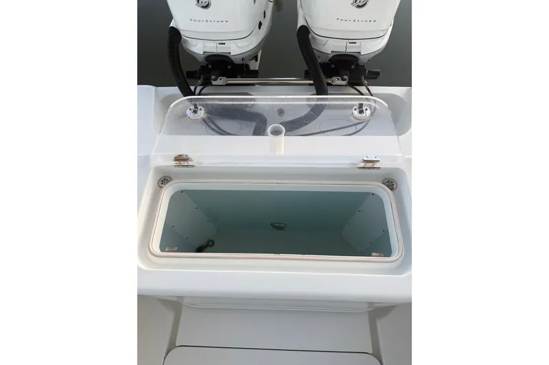 Slide: The Image of Livewell on 2014 Yellowfin 32 Offshore boat with dual outboard engines. - 15