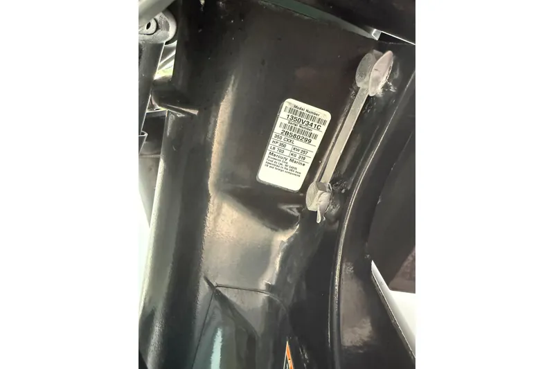 Slide: The Image of Close-up of a 2014 Yellowfin 32 Offshore boat engine part with a visible label. - 21