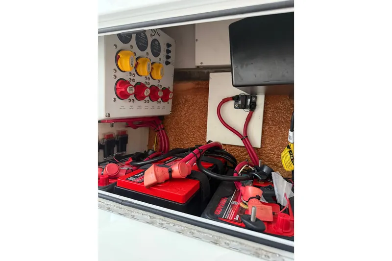 Slide: The Image of Electrical system of a 2014 Yellowfin 32 Offshore boat, featuring batteries and wiring. - 19