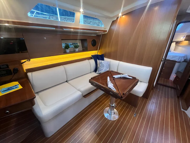 Slide: The Image of Luxurious interior of 2025 Catalina 386 yacht with elegant seating and wooden finishes. - 9