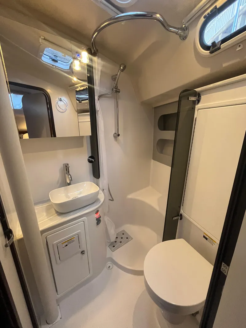 Slide: The Image of Modern bathroom in 2025 Catalina 386 yacht with shower, sink, and toilet. - 15