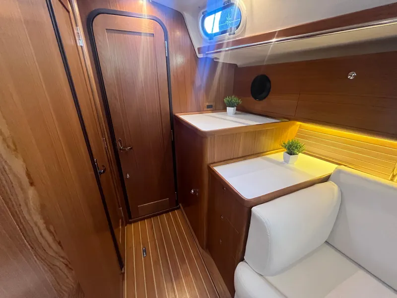 Slide: The Image of Luxurious interior of 2025 Catalina 386 yacht with wood finish and modern lighting. - 11