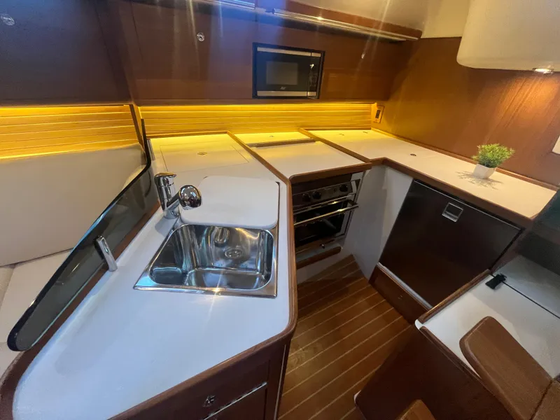Slide: The Image of Modern kitchen in 2025 Catalina 386 yacht with sleek countertops and stainless steel sink. - 7