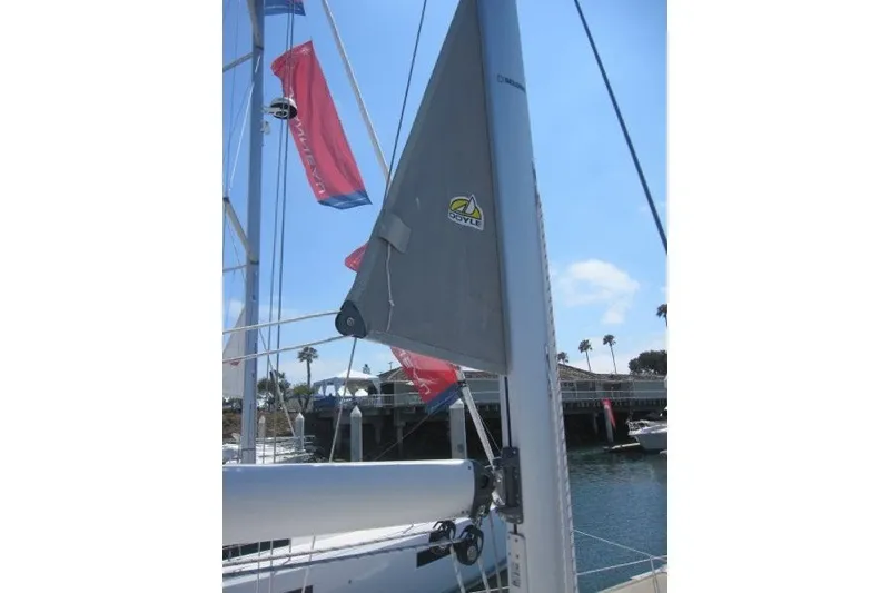 Slide: The Image of Sailboat mast and sail of 2025 Catalina 386, docked with clear sky background. - 50