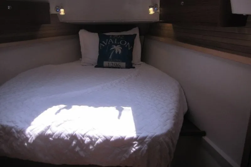 Slide: The Image of Cozy cabin interior of 2025 Catalina 386 yacht with a neatly made bed. - 28