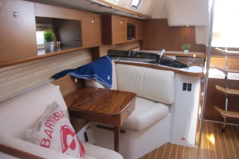 Slide: The Image of Interior of 2025 Catalina 386 yacht with cozy seating and modern kitchen. - 31