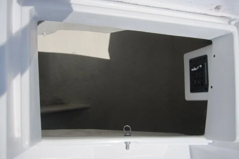 Slide: The Image of Storage compartment of a 2025 Catalina 386 sailboat, featuring a latch and control panel. - 53