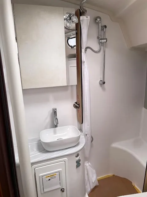 Slide: The Image of Modern bathroom in 2025 Catalina 386 yacht with shower and sink. - 16
