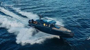 Slide: The Image of 2024 XO Boats EXPLR 10S cruising on open water. - 13