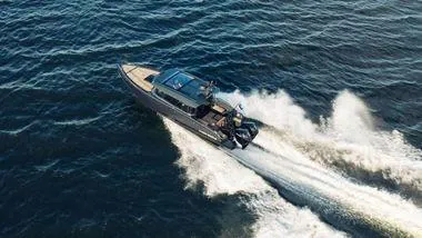 Slide: The Image of 2024 XO Boats EXPLR 10S speeding on open water. - 12