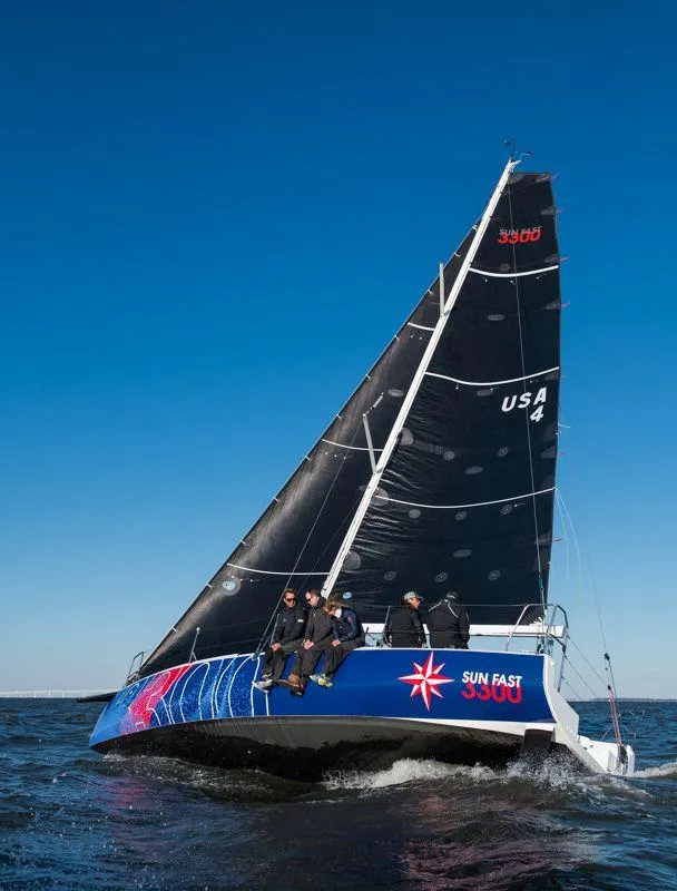 Slide: The Image of 2025 Jeanneau Sun Fast 3300 sailing on open water under clear blue sky. - 25