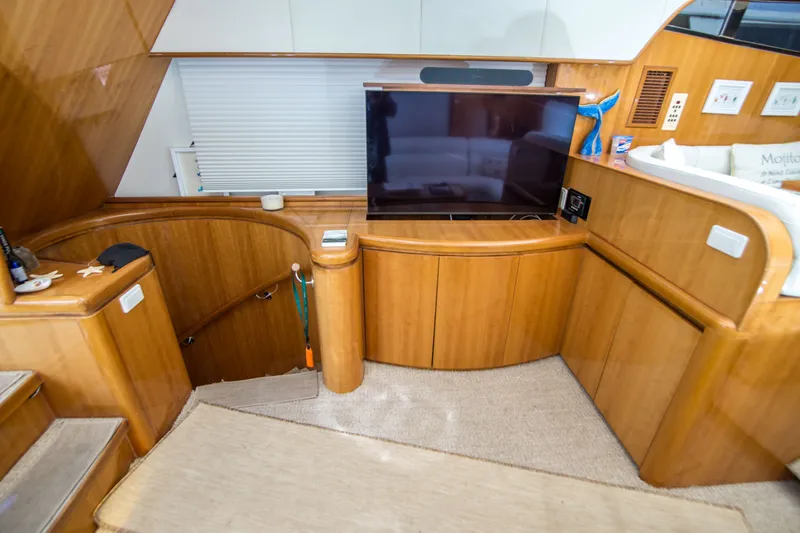 Slide: The Image of Luxurious interior of a 2000 Johnson 58 yacht with wooden cabinetry and modern amenities. - 29