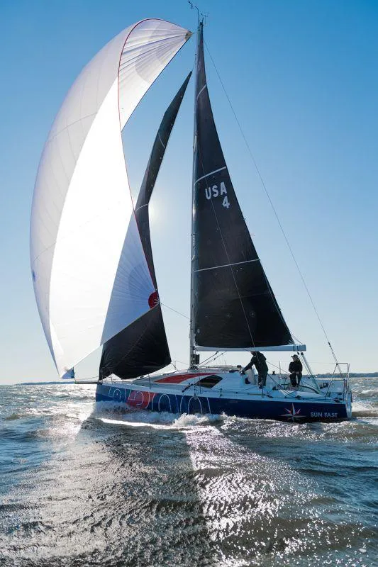 Slide: The Image of 2025 Jeanneau Sun Fast 3300 sailing on open water with full sails. - 21