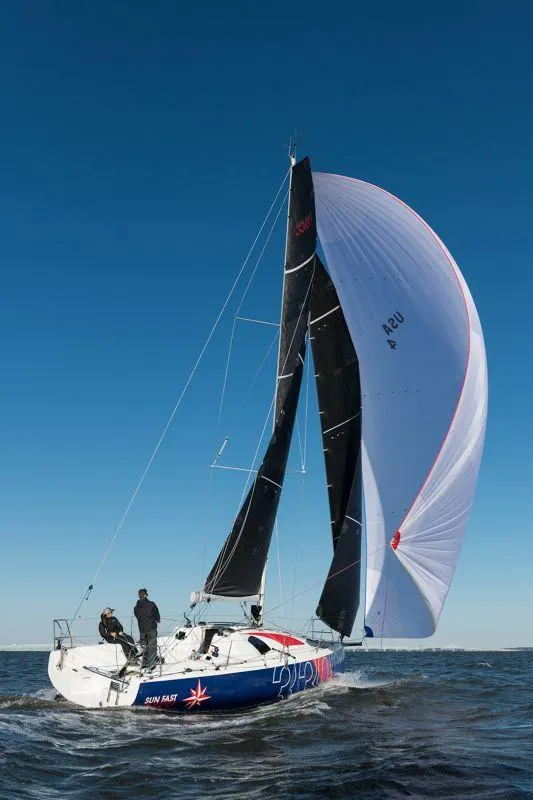 Slide: The Image of 2025 Jeanneau Sun Fast 3300 sailing on open water with full sails. - 20