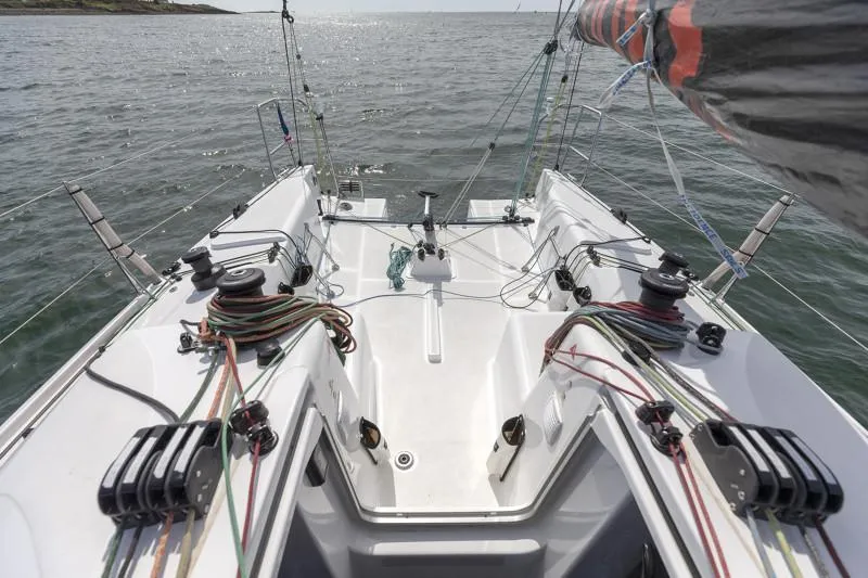 Slide: The Image of 2025 Jeanneau Sun Fast 3300 sailboat cockpit with rigging and ocean view. - 42