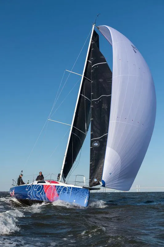 Slide: The Image of 2025 Jeanneau Sun Fast 3300 sailing with spinnaker on open water. - 23