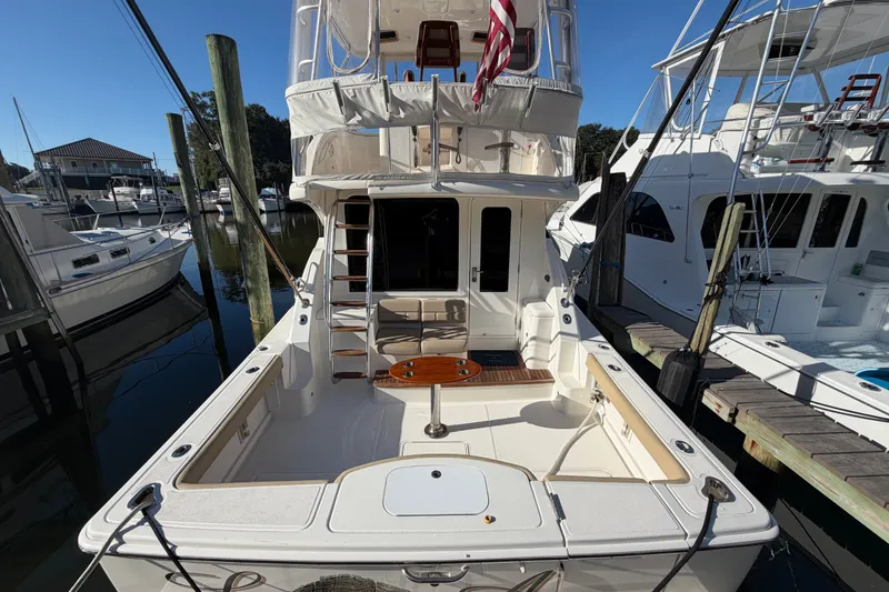 Slide: The Image of 2017 Tiara Yachts 39 Convertible docked, showcasing spacious deck and elegant design. - 58