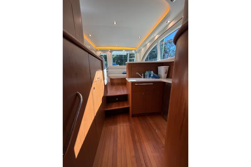 Slide: The Image of Interior of 2017 Tiara Yachts 39 Convertible with wood finish and modern lighting. - 54