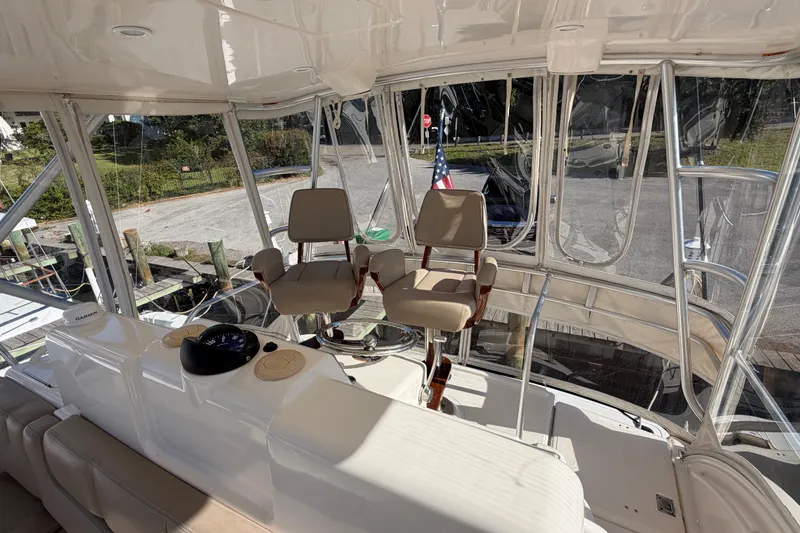 Slide: The Image of 2017 Tiara Yachts 39 Convertible helm with dual captain chairs and navigation equipment. - 37