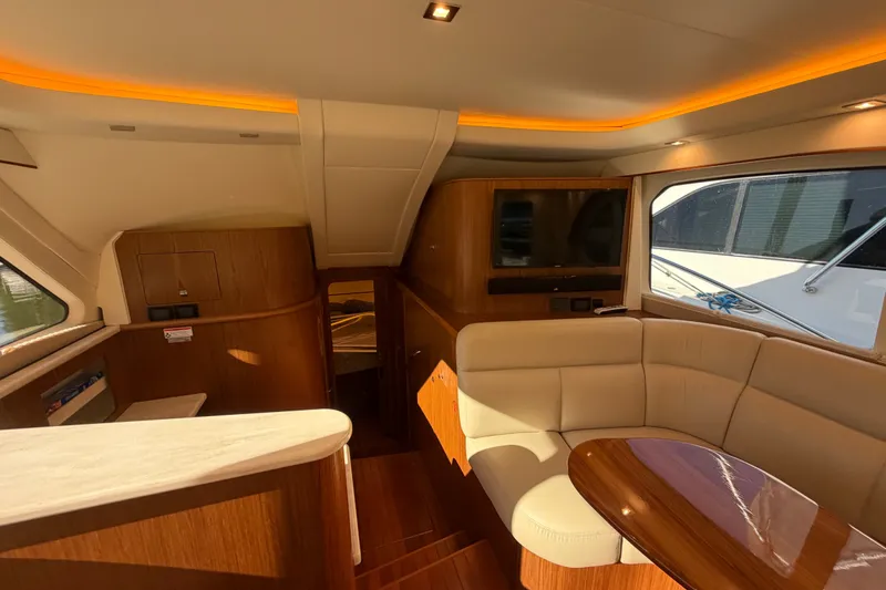 Slide: The Image of Luxurious interior of 2017 Tiara Yachts 39 Convertible with elegant seating and wood finishes. - 49