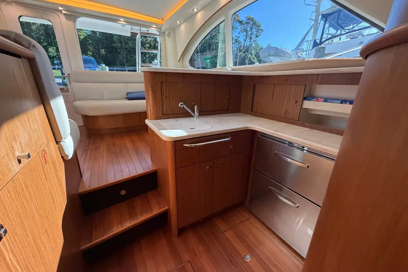 Slide: The Image of Luxurious interior of 2017 Tiara Yachts 39 Convertible with wood finishes and modern amenities. - 50