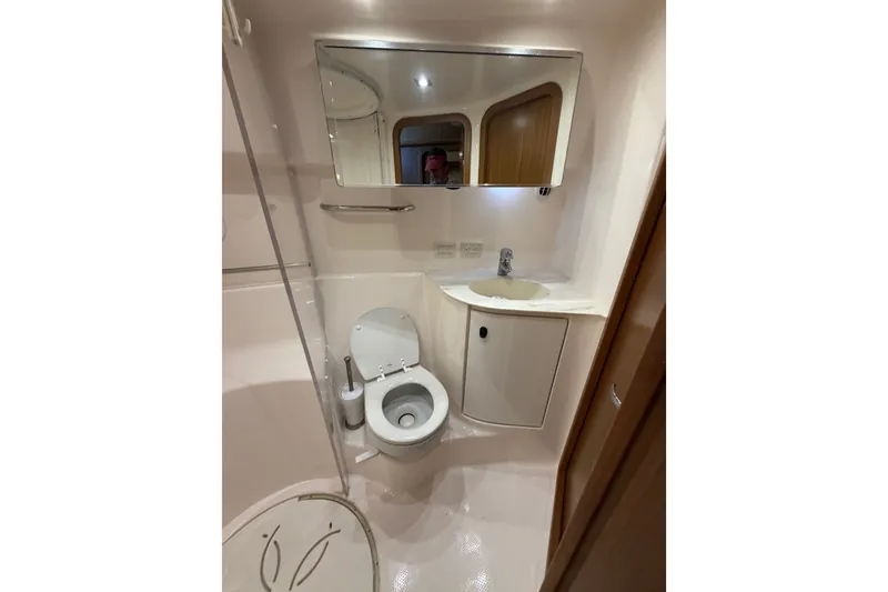 Slide: The Image of Bathroom interior of 2017 Tiara Yachts 39 Convertible, featuring toilet and sink. - 52