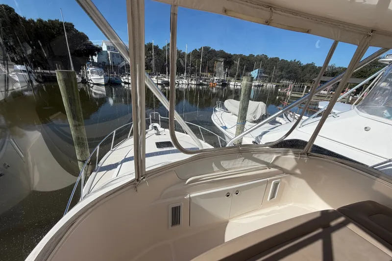 Slide: The Image of 2017 Tiara Yachts 39 Convertible at marina, view from cockpit. - 38