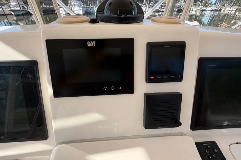 Slide: The Image of Control panel of a 2017 Tiara Yachts 39 Convertible with CAT and Garmin displays. - 45
